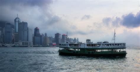 Barge on Body of Water Near High-rise Buildings · Free Stock Photo