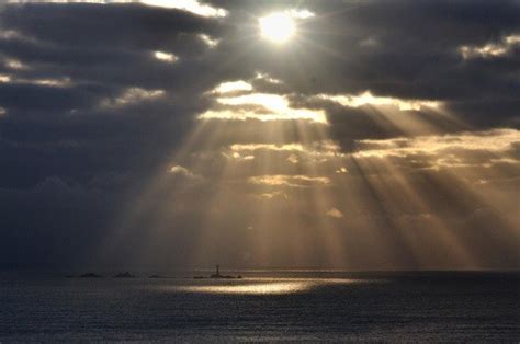 The sunbeam illusion or crepuscular rays. The sun shines through clouds... | Download Scientific ...