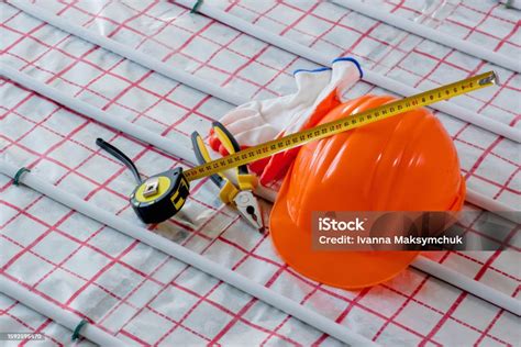 Tools For Repair Hard Hat Plier Glove On Warm Floor Installation Of A Warm Floor Stock Photo ...