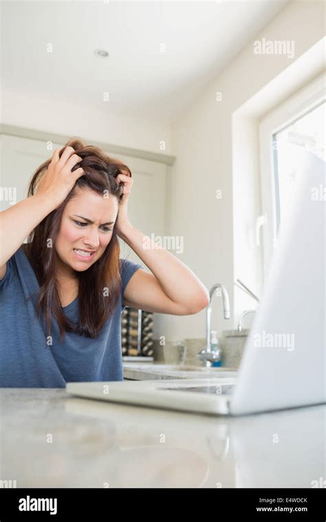 Angry woman with laptop Stock Photo - Alamy