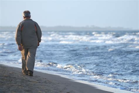 lonely older man walking on beach - Paradigm Change