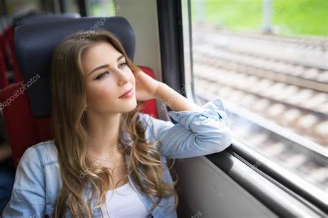 Beautiful woman in train Stock Photo by ©Deklofenak 105369264