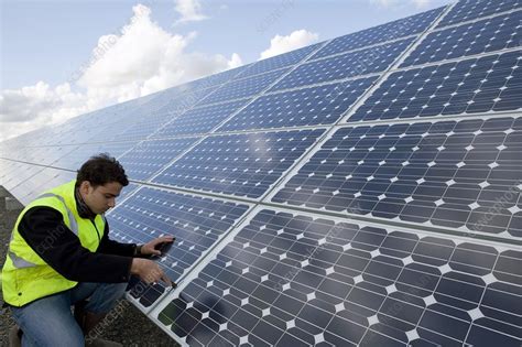 Solar panels maintenance - Stock Image - C011/4012 - Science Photo Library