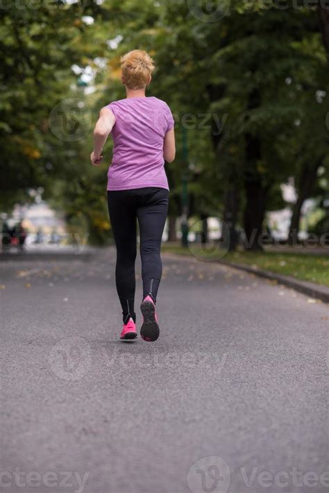 sporty female runner training for marathon 10803029 Stock Photo at Vecteezy