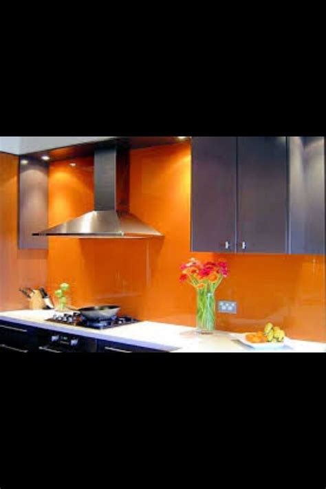 Orange splashback | Orange kitchen, Glass backsplash, Best kitchen cabinet paint