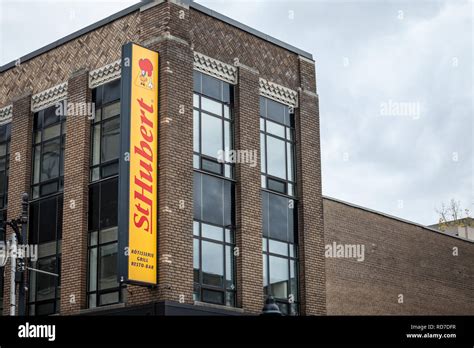 MONTREAL, CANADA - NOVEMBER 8, 2018: St Hubert logo, in front of their local restaurant in ...