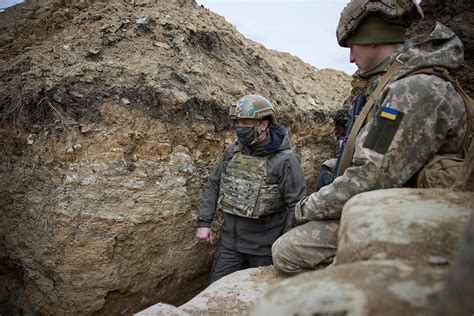 Ukraine's President heads to the trenches as Russia masses its troops