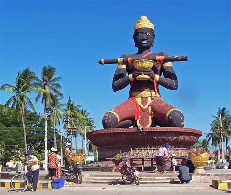 The entrance to Battambang, Cambodia is dominated by a huge, black painted, statue of King Ta ...