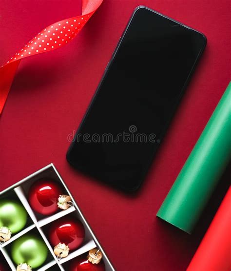 Christmas Phone App and Holiday Message Concept. Smartphone with Blank Black Screen and Xmas ...