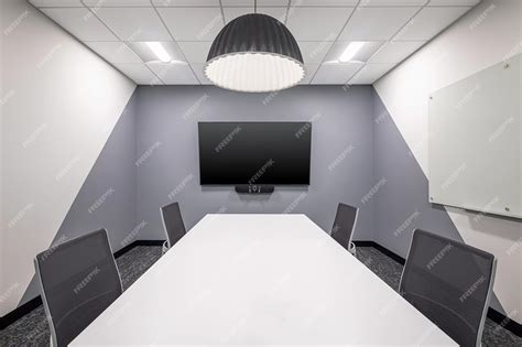 Premium Photo | Conference Room With Wall Mounted Screen