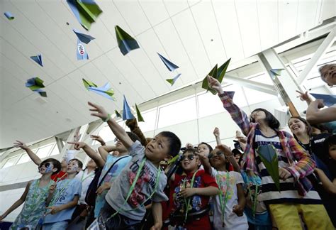 Young participants fly their paper airplanes during the paper airplane ...