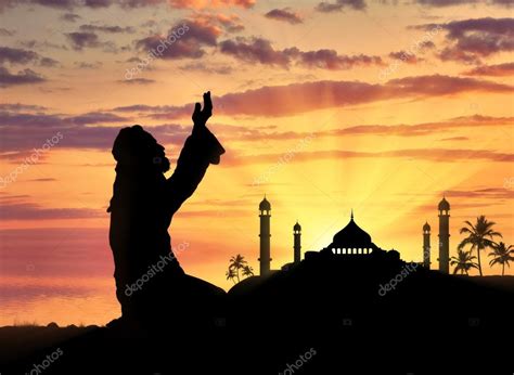 Muslim praying on a background of a mosque Stock Photo by ©Prazisss 119871442