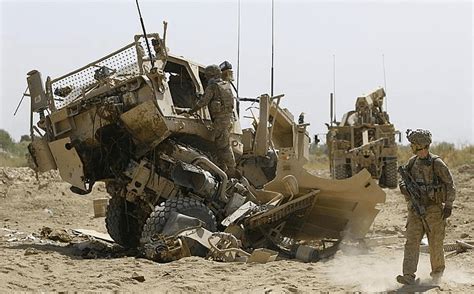 The aftermath of an Oshkosh MATV MRAP after it hit an IED consisting of ~300 pounds of military ...