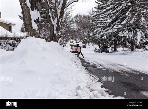 Man shoveling snow after a snowstorm in Flagstaff, Arizona Stock Photo - Alamy