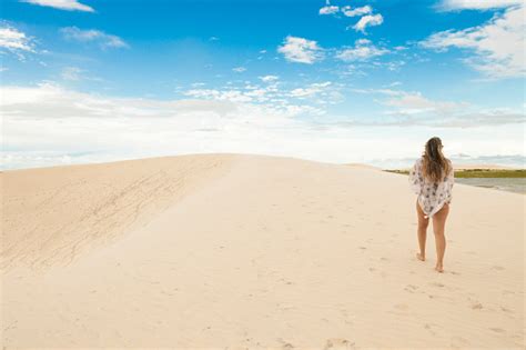 Woman On Jericoacoara Dune At Sunset Stock Photo - Download Image Now - Adult, Adults Only ...