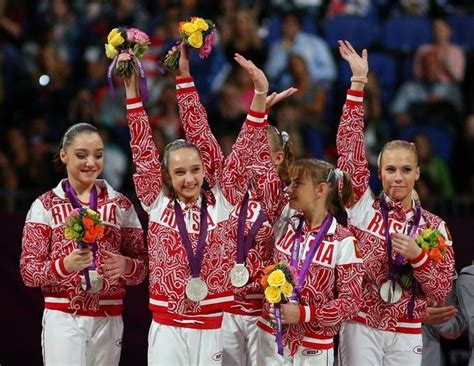 A silver for Russia: Russia's gymnasts left to right, Aliya Mustafina ...