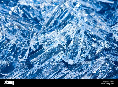 Ice crystals (peaces) sparkling blue texture close up, christmas winter ...