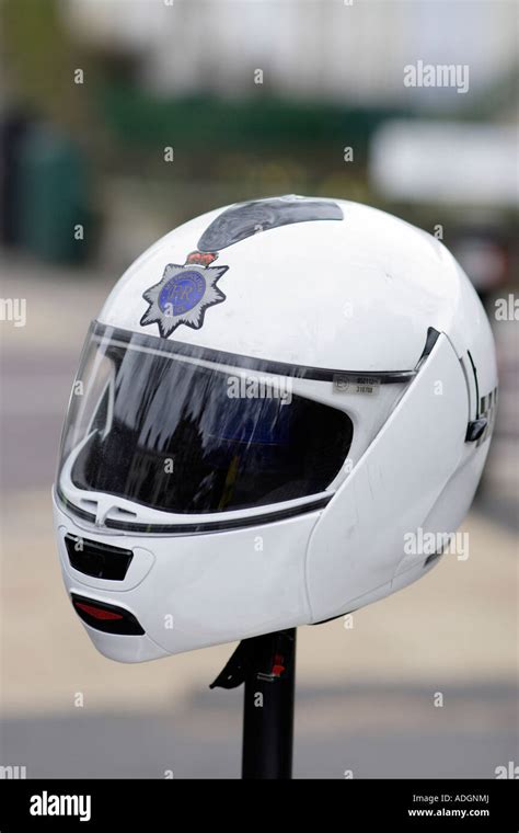 Londons Metropolitan Police motorcycle helmet on rear of motor cycle ...