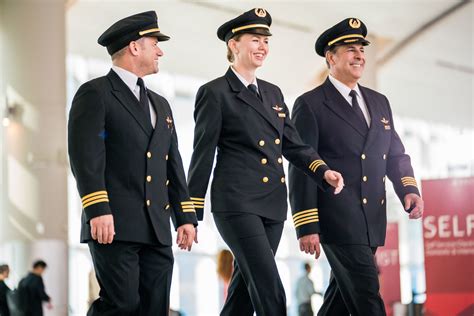 Pilots walking in airport | Delta News Hub