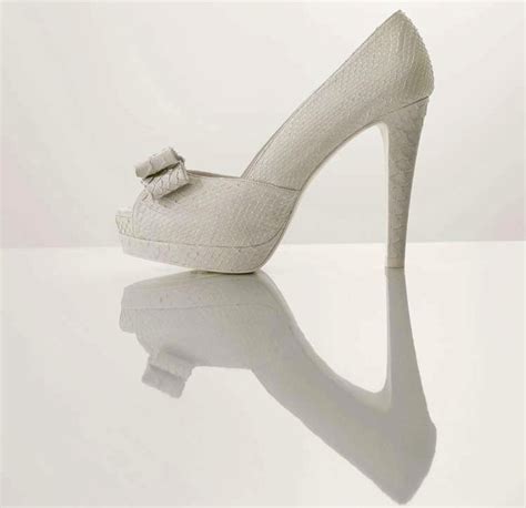 splurge worthy wedding heels white platform bridal pumps with bow detail | OneWed.com