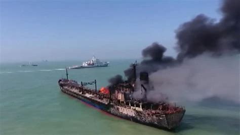 China: Oil tanker on fire colliding with cargo ship | World News | Sky News