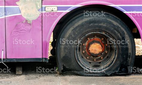 Old Bus Flat Tire On Road Stock Photo - Download Image Now - At The ...