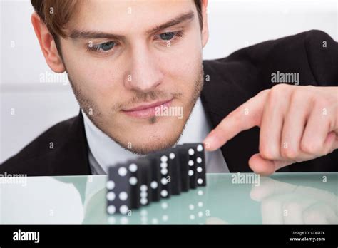 Young Businessman Playing Domino At Office Desk Stock Photo - Alamy