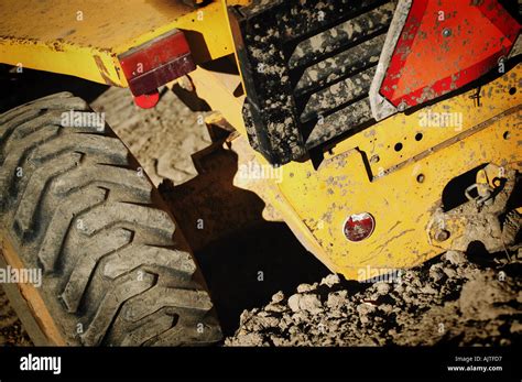 Tractor tires in mud Stock Photo - Alamy