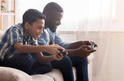 Parents playing five extra hours of video games a week to bond with their children, poll finds ...