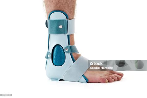 Man Wearing Ankle Support Cast In White Studio Stock Photo - Download ...