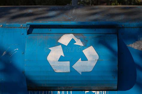 White Recycling Sign on the Blue Recycle Bin Stock Photo - Image of ...