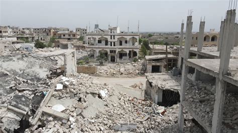 Premium stock video - War-torn syrian city with rubble of collapsed and crumbled buildings