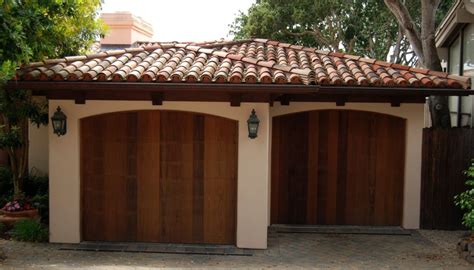 Spanish style ceramic tile roof on two-car garage with wooden doors | Spanish style house ...