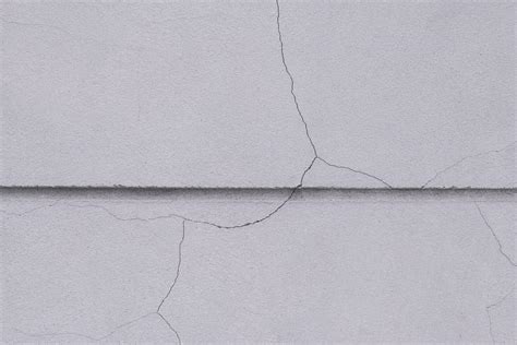 Crack line texture on surface of concrete fence wall background outside ...