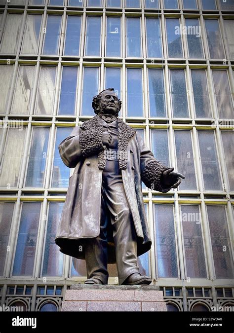 The statue of Commodore Cornelius Vanderbilt in front of a large window ...