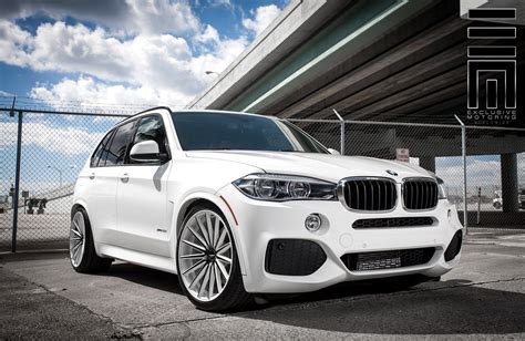 BMW X5 Stanced on Classy Custom Wheels by Exclusive Motoring | CARiD.com Gallery