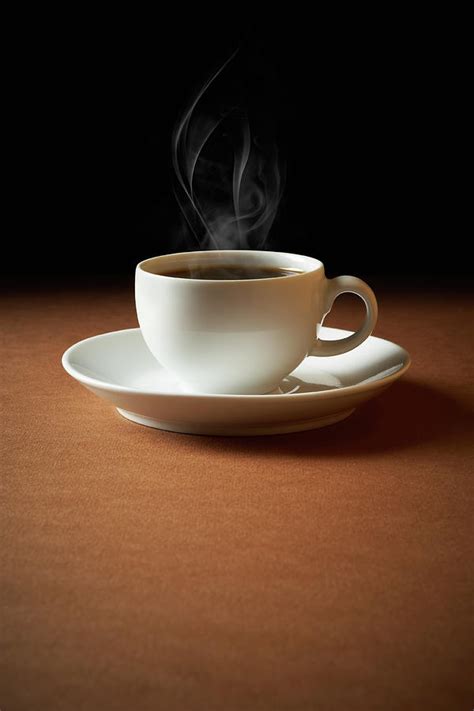 White Cup Of Coffee Sends Up Steam Photograph by Hdere - Fine Art America