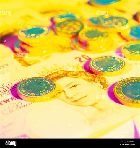 British sterling pound notes and coins Stock Photo - Alamy