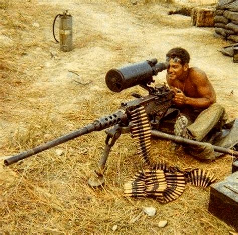 US Marine using a .50cal M2 Browning heavy machine gun with scope near Khe Sanh, Vietnam, 1968 ...