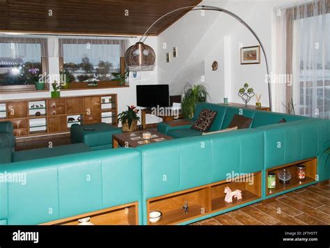 Modern living room in green Stock Photo - Alamy