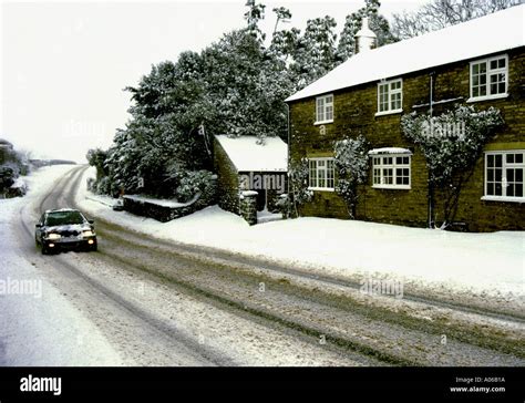 Snow on country road North Yorkshire England Stock Photo - Alamy