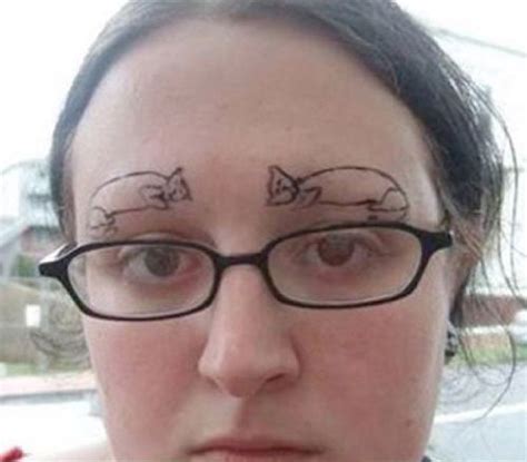 a woman with glasses has pig drawn on her forehead