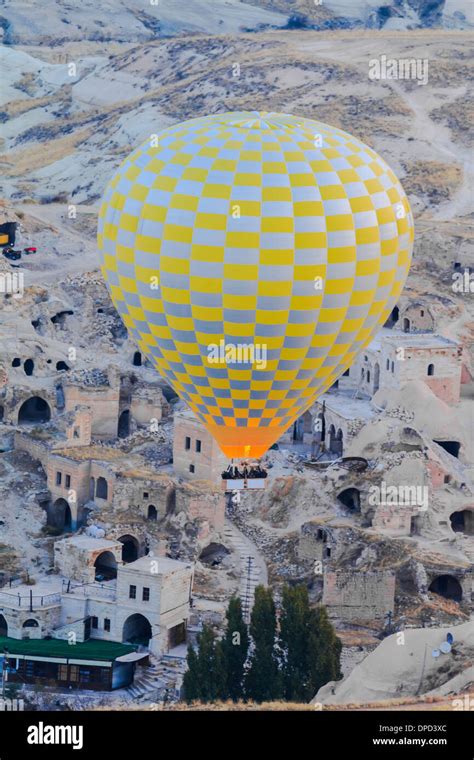 Hot air balloon flying over goreme in cappadocia, turkey Stock Photo - Alamy