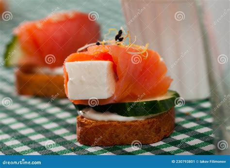 Canape with Salmon, Young Cheese, Cucumber Stock Image - Image of ...