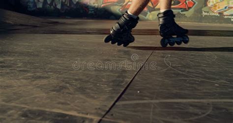 Sporty Man Performing Tricks on Roller Skates at Modern Urban Skate Park. Stock Photo - Image of ...