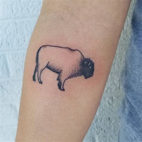 Tiny buffalo tattoo by Eliza Johnson | Tattoos and piercings, Bison tattoo, Tattoos