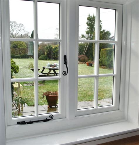 an open window with the view of a yard and picnic table in the back ground