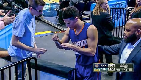 Devin Booker Signs Autograph for Fan in Classiest Exit Ever | NBA.com