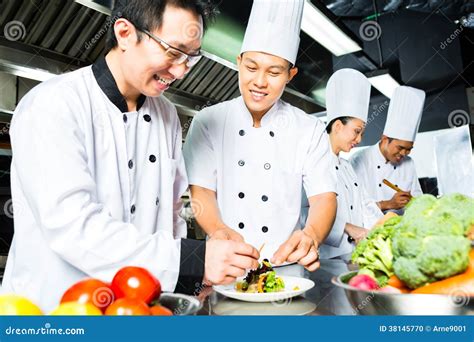 Asian Chef In Restaurant Kitchen Cooking Stock Photo - Image: 38145770