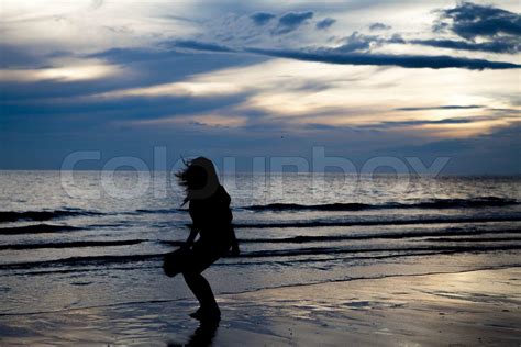 Silhouette girl on beach | Stock image | Colourbox